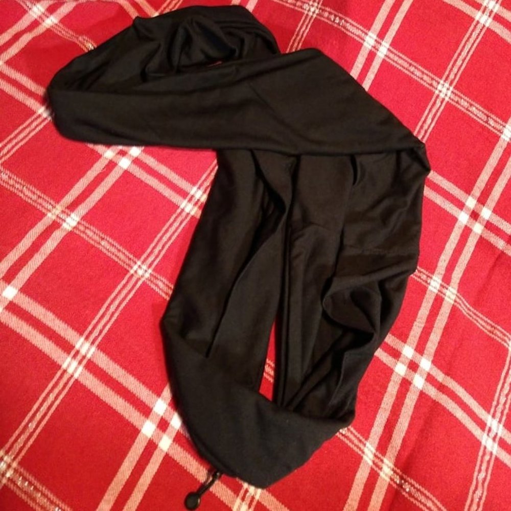 Soft black infinity scarf with hidden zippered pocket